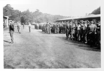 Rows of American prisoners assembled for roll call