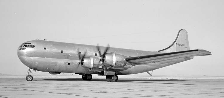 Silver YC-97A cargo aircraft parked on a ramp, serial 559590 on the tail
